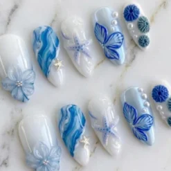 Alternative view of Summer Ocean Press On Nails with 3D Flower, Starfish & Pearl in Medium Almond Fake Nails, Custom Handmade Blue Beach Nail Art for Vacation