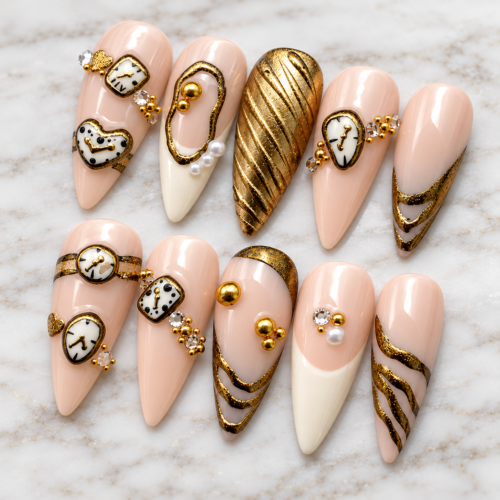 Elegant pink and gold press on nails with metallic gold swirls, vintage clock designs, and 3D embellishments.