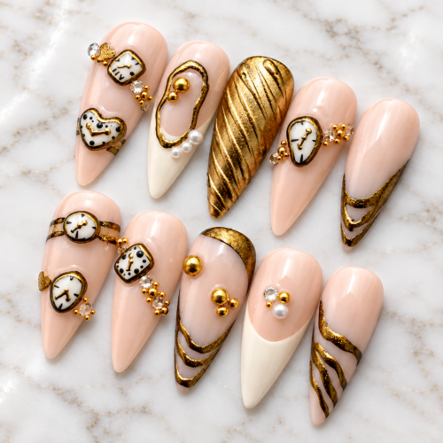 Handmade luxury stiletto press on nails with antique clock charms, gold details, and pearls on white marble.