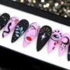 Celestial press-on nails from the other end of the tray: a lilac face nail, a gold firework burst and a moon