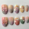 Pastel short almond press on nails with painted rainbows, 3D clouds, sugar glitter and iridescent bows