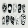Black and white coffin press on nails hand-drawn with bunnies, a bear, a ghost, stars, spirals and stripes