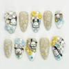 Beige checkerboard almond press on nails with hand-painted white puppies, 3D yellow and blue bows and gems
