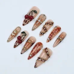 Alternative view of Leopard Luxe Almond PressOn Nail with Gold Details and 3D Cherry Gel, Handmade Statement Nail for a Fierce & Glamorous Look or Gift for Her