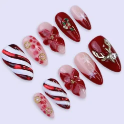 Alternative view of Christmas Press On Nails | Red Candy Cane, Poinsettia & Reindeer Design | Medium Almond | Handmade Holiday Nail Art