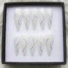 Milky white stiletto press on nails with a single silver glitter swirl line on each nail