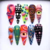 Psychedelic press on nails with 3D squiggles, spirals, spotted mushrooms and sculpted eyeballs in neon colours