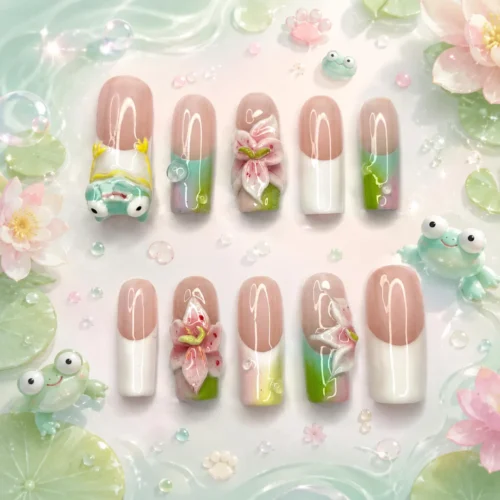 Frog press-on nails on a pastel pond backdrop with lily pads and small frogs, showing 3D lilies and French tips