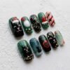 Press-on nails featuring Christmas ornament designs
