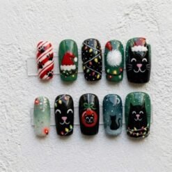 Christmas black cat press-on nails in green and black with cats in Santa hats, string lights and paw prints
