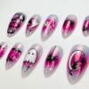 Press-on nails featuring a cat sitting on the moon