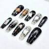 Press-on nails featuring a pumpkin wearing a witch's hat and a spooky magical house.