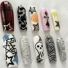 Press-on nails with 3D raised circle patterns