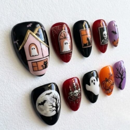 Press-on nails with pumpkin and black bat designs