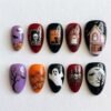 Black cat Halloween press-on nails in black, wine red and lilac with a pink ghost house, a skeleton, pumpkins and bats