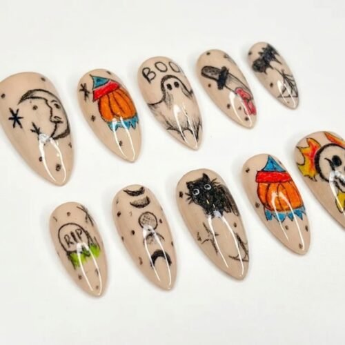 Press-on nails featuring a pumpkin wearing a green hat
