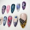 Press-on nails featuring skeleton hand and star designs.