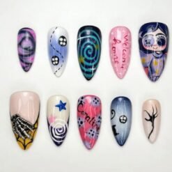 Halloween skeleton hand press-on nails in pink, navy and lilac with a silver 3D hand, button eyes and a teal spiral