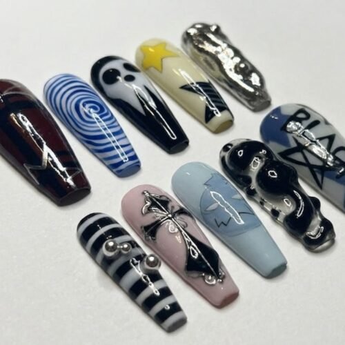 Long coffin press-on nails in black, blue, silver and cream with a skull mask, a gothic cross, a blue spiral and stripes