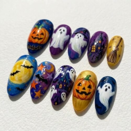Hand-painted Halloween scenes on almond press-on nails: grinning pumpkins, ghosts, a haunted house, a moon with bats