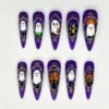 Haunted ghost press-on nails in deep purple with 3D white ghosts in ornate gold frames, pumpkins and a haunted house