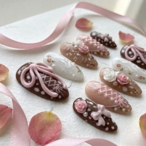 False nails featuring bow patterns and 3D crisscross lace-up designs.