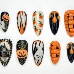 Pumpkin Halloween press-on nails in orange, black and cream with ribbed 3D pumpkins, white ghosts and gold spiderwebs