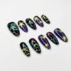 Press-on nails featuring ghost and star designs on a glittery base.