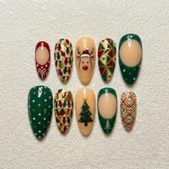 Christmas tree press-on nails in pine green, red and cream with a reindeer in a Santa hat, string lights and gold lines