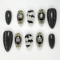 Spooky black glitter press-on nails in black and milky white with ghosts in gold mirror frames and black bats