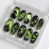 Press-on nails with black bat patterns
