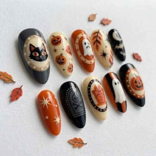 Cute yet spooky. Pumpkin and ghost motifs. Hand-painted nail art.