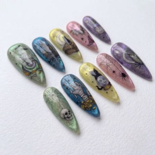 Halloween-themed press-on nails featuring witch and owl designs.