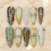 pearlescent chrome press-on nails with gold swirls, silver panels, milky white, sage shimmer and pearl-like beads