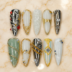 pearlescent chrome press-on nails with gold swirls, silver panels, milky white, sage shimmer and pearl-like beads