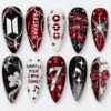 BTS concert press-on nails in red, black and white with glitter, silver accents and raised nail art