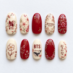 BTS Arirang floral press-on nails in crimson and ivory with blossoms, leafy branches, Korean lettering and a whale