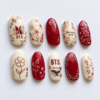 Press-on nails featuring the BTS logo and cherry blossoms.