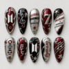 BTS concert press-on nails in red, black and silver with glitter, stars, music notes and tour lettering