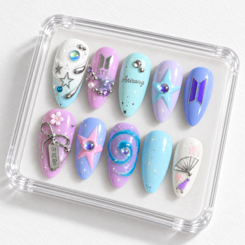 Cool blue-toned BTS press-on nails featuring logo and chain motifs.