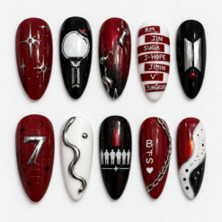 BTS concert press-on nails in crimson, black and white with star accents, silver details and member names