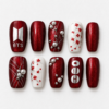 BTS pearl press-on nails in deep red and white with glitter, silver lines, pearl accents and red blossoms