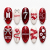 BTS red glitter press-on nails with silver bows, ARIRANG lettering, a rose, whale art and member-name ribbons