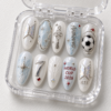 BTS-themed press-on nails featuring a soccer motif