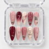 BTS Love Yourself press-on nails in blush pink and burgundy with silver bows, hearts, stars and the number 7