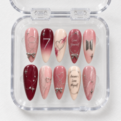 BTS Love Yourself press-on nails in blush pink and burgundy with silver bows, hearts, stars and the number 7