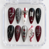BTS galaxy press-on nails in crimson, black and silver with star art, glitter and a raised number 7 in a case