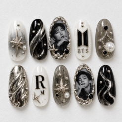 BTS portrait press-on nails in black, ivory and silver with star details, pearl accents and chrome-style swirls