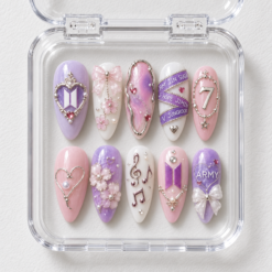 BTS pink floral press-on nails with lavender accents, pearl-like details, bows, music notes and member-name bands