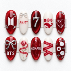 BTS red glitter press-on nails with silver bows, ARIRANG lettering, a rose, whale art and member-name ribbons
